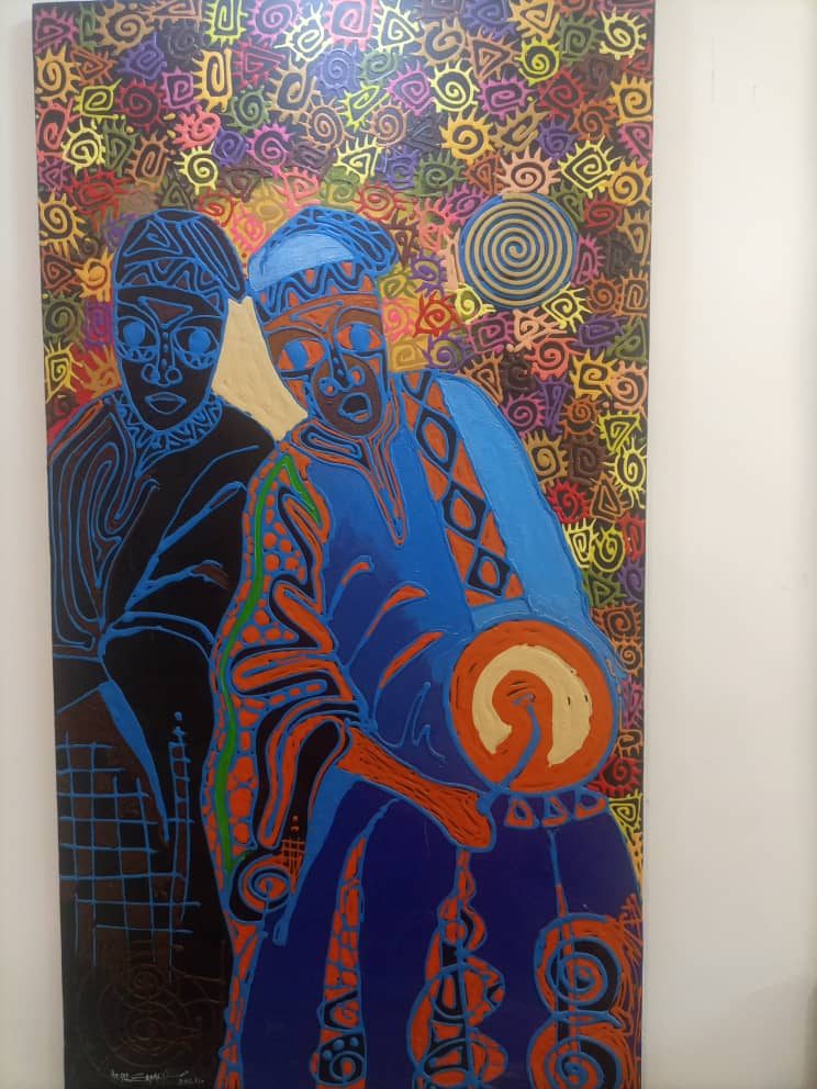 Two figures in blue